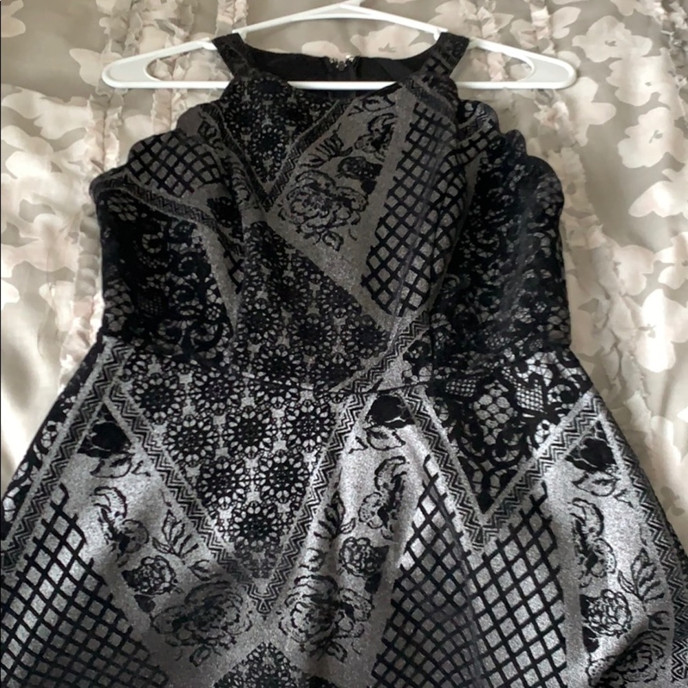 Short black velvet dress.